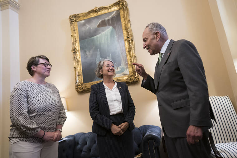 ASSOCIATED PRESS
                                Senate Majority Leader Chuck Schumer, D-N.Y., right, welcomes Paivi Nevala, minister counselor of the Finnish Embassy, left, and Karin Olofsdotter, Sweden’s ambassador to the U.S., center, just before the Senate vote to ratify NATO membership for the two nations in response to Russia’s invasion of Ukraine, at the Capitol in Washington, today.