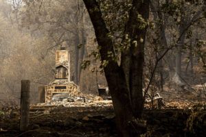 ASSOCIATED PRESS / AUG. 2
                                A chimney stands at a home destroyed by the McKinney Fire on Tuesday, in Klamath National Forest, Calif.