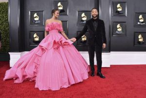 INVISION / AP / APRIL 3
                                Chrissy Teigen, left, and John Legend arrive at the 64th Annual Grammy Awards at the MGM Grand Garden Arena in Las Vegas.