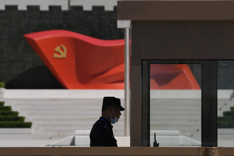 ASSOCIATED PRESS
                                A security guard stands near a sculpture of the Chinese Communist Party flag at the Museum of the Communist Party of China, May 26, in Beijing. China says it conducted “precision missile strikes” in the Taiwan Strait on Thursday as part of military exercises that have raised tensions in the region to their highest level in decades.