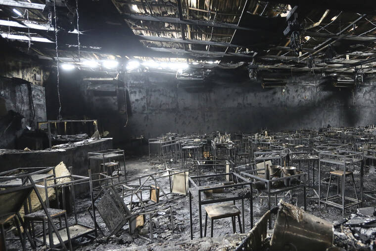 ASSOCIATED PRESS
                                Major fire damage fills the interior at the Mountain B pub in the Sattahip district of Chonburi province, about 160 kilometers (100 miles) southeast of Bangkok, Thailand.