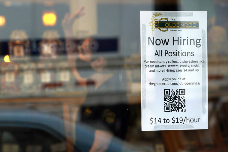 ASSOCIATED PRESS
                                A sign advertises for help The Goldenrod, a popular restaurant and candy shop, June 1, in York Beach, Maine. America’s hiring boom continued in July as employers added a surprising 528,000 jobs despite raging inflation and rising anxiety about a recession.