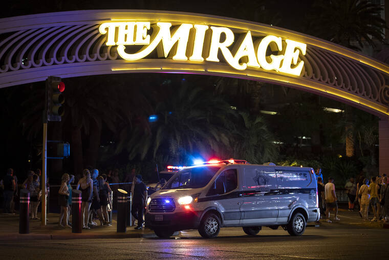 ELLEN SCHMIDT/LAS VEGAS REVIEW-JOURNAL VIA ASSOCIATED PRESS
                                Metropolitan police are stationed outside The Mirage in response to a fatal shooting in the hotel-casino, Thursday, in Las Vegas.