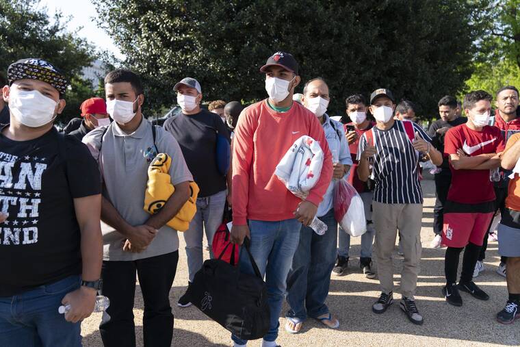 ASSOCIATED PRESS
                                Migrants hold Red Cross blankets after arriving at Union Station near the U.S. Capitol from Texas on buses, April 27, in Washington. The Pentagon has rejected a request from the District of Columbia seeking National Guard assistance for the thousands of migrants being bused to the city from two southern states.