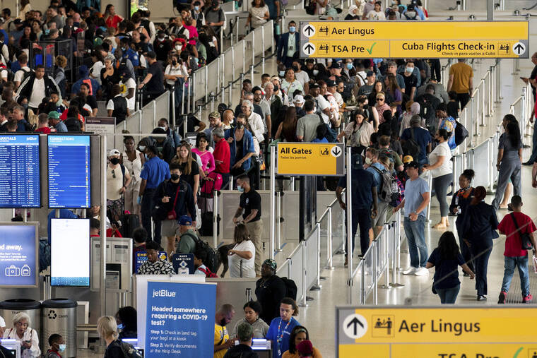 ASSOCIATED PRESS
                                People wait in a TSA line at the John F. Kennedy International Airport, June 28, in New York. Tens of thousands of flyers had their travel plans upended, today, after airlines canceled more than 1,100 flights for a second straight day because of thunderstorms hitting the East Coast.