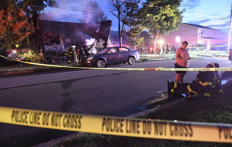 JIMMY MAY/BLOOMSBURG PRESS ENTERPRISE VIA ASSOCIATED PRESS
                                Firefighters set up lights in front of a fatal house fire at 733 First Street in Nescopeck, Pa, today. The fire in Nescopeck was reported around 2:30 a.m. The cause of the fire remains under investigation.