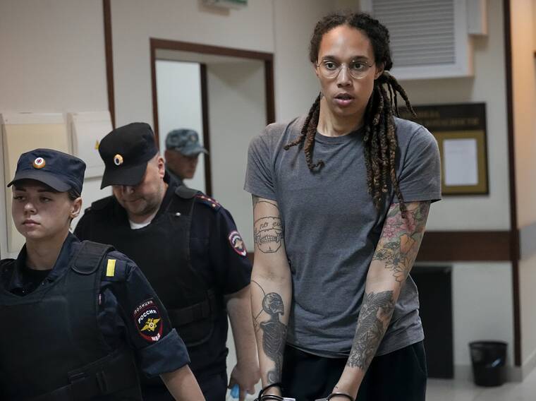 ASSOCIATED PRESS
                                WNBA star and two-time Olympic gold medalist Brittney Griner is escorted from a courtroom ater a hearing, in Khimki just outside Moscow, Russia, Thursday. A judge in Russia has convicted American basketball star Brittney Griner of drug possession and smuggling and sentenced her to nine years in prison.