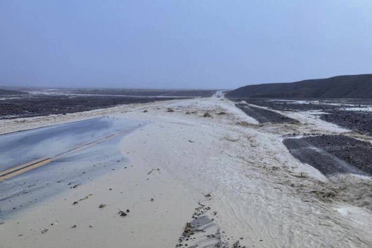 NATIONAL PARK SERVICE / AP
                                Highway 190 is closed due to flash flooding in Death Valley National Park, Calif., Friday, Aug. 5.