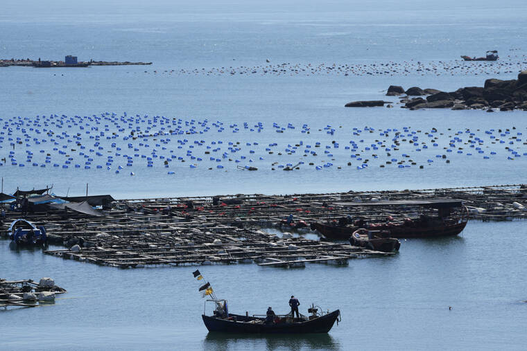 ASSOCIATED PRESS
                                A boat moves through the water at the 68-nautical-mile scenic spot, the closest point in mainland China to the island of Taiwan, in Pingtan in southeastern China’s Fujian Province on Friday.