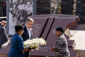 ANDREW HARNIK, POOL/AP
                                Secretary of State Antony Blinken and Antoinette Sithole, the sister of the late Hector Pieterson, right, lay a wreath at the Hector Pieterson Memorial in Soweto, South Africa. Peaceful child protesters were gunned down by police 30 years ago in an attack that awakened the world to the brutality of the apartheid regime. At top, is an iconic picture of Antoinette, running with mouth open in a scream alongside a friend carrying the body of her slain brother, Hector.