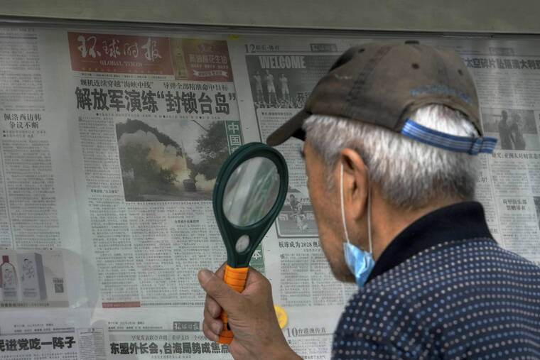 ASSOCIATED PRESS
                                A man uses a magnifying glass to read a newspaper headline reporting on Chinese People’s Liberation Army (PLA) conducting military exercises, at a stand in Beijing. U.S. Secretary of State Antony Blinken said Saturday that China should not hold hostage talks on important global matters such as the climate crisis, after Beijing cut off contacts with Washington in retaliation for U.S. House Speaker Nancy Pelosi’s visit to Taiwan earlier this week.