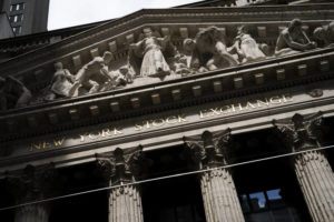 ASSOCIATED PRESS
                                Statues adorn the facade of the New York Stock Exchange, July 14, in New York. Major stock indexes on Wall Street gave up early gains and ended a choppy day of trading little changed today.