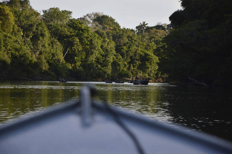 RODRIGO VARGAS VIA AP
                                In this July 22, 2019, file photo provided by Rodrigo Vargas, a boat moves through Cristalino II State Park in the state of Mato Grosso, Brazil.