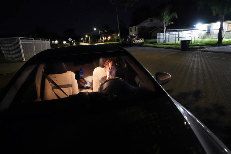 ASSOCIATED PRESS
                                Jada Riley sits in her car at night with her son Jayden Harris, 6, as she contemplates where she might spend the night, having had to move out of her apartment a few days before, July 28, in New Orleans. “I’ve slept outside for a whole year before. It’s very depressing, I’m not going to lie,” said Riley, who often doesn’t have enough money to buy gas or afford food every day. “I don’t want to have my son experience any struggles that I went through.”