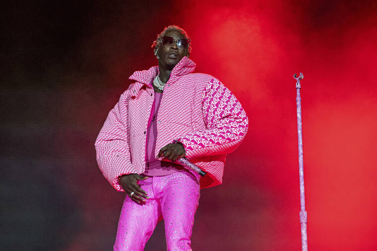 INVISION / AP / 2021
                                Young Thug performs on Day 4 of the Lollapalooza Music Festival on Aug. 1, 2021, at Grant Park in Chicago.