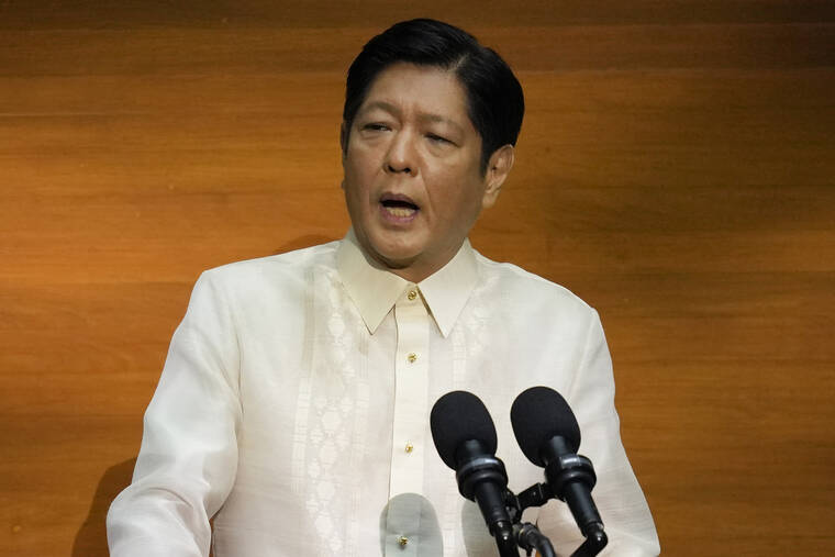 ASSOCIATED PRESS
                                Philippine President Ferdinand Marcos Jr. delivers his first state of the nation address in Quezon City, Philippines, July 25. Marcos Jr. may fire top agricultural officials if an investigation shows that they maliciously decided to import sugar amid a shortage without his approval and then publicized the plan, the press secretary said Thursday.