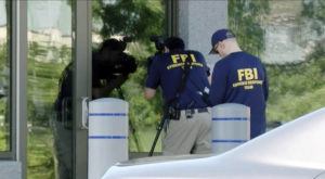 WKEF/WRGT / AP
                                In this still image taken from WKEF/WRGT video, members of the FBI Evidence Response Team work outside the FBI building in Kenwood, Ohio, Thursday, Aug. 11.