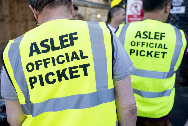 PA VIA AP
                                Aslef, Associated Society of Locomotive Engineers and Firemen members are pictured on a picket line at Willesden Junction station as members of the drivers union at nine train operators walk out for 24 hours over pay in London.