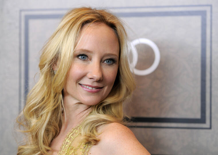 CHRIS PIZZELLO/INVISION/ASSOCIATED PRESS
                                Actor Anne Heche poses at Variety’s 4th annual Power of Women event in Beverly Hills, Calif., in October 2012. Heche, the Emmy-winning film and television actor whose dramatic Hollywood rise in the 1990s and accomplished career contrasted with personal chapters of turmoil, died of injuries from a fiery car crash. She was 53.