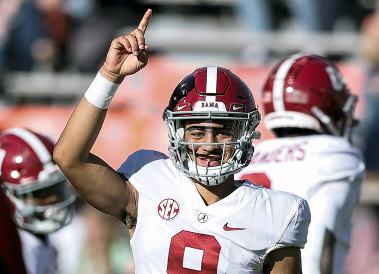 ASSOCIATED PRESS
                                Alabama quarterback Bryce Young during warm-ups before the start of a game against Auburn Saturday, Nov. 27, in Auburn, Ala. Alabama is No. 1 in the preseason AP Top 25 for the second straight season.