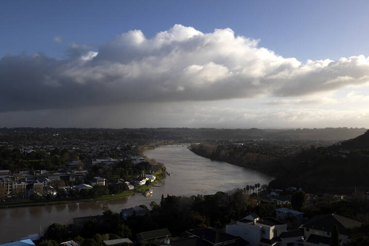 ASSOCIATED PRESS
                                The Whanganui River winds through the town of Whanganui, New Zealand, on June 15. In 2017, New Zealand passed a groundbreaking law granting personhood status to the river.