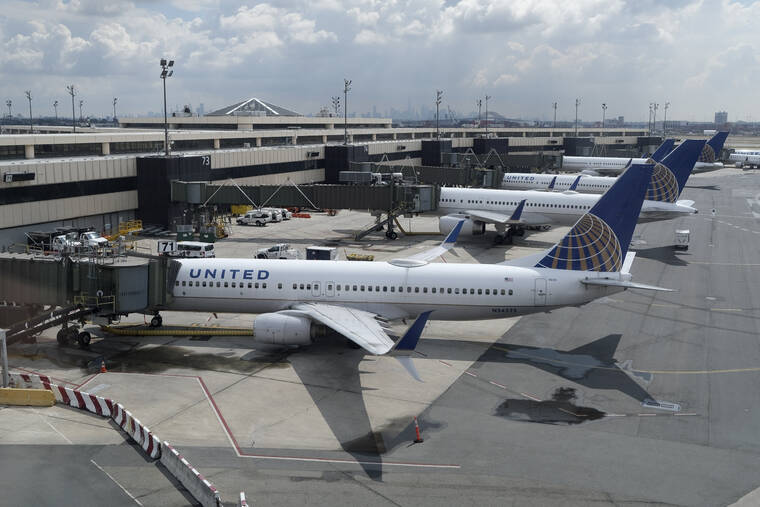ASSOCIATED PRESS / 2020
                                United Airlines planes are parked at gates at Newark Liberty International Airport in Newark, N.J.