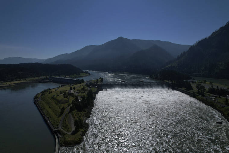ASSOCIATED PRESS
                                Water spills over the Bonneville Dam on the Columbia River, which runs along the Washington and Oregon state line, June 21. Hydroelectric dams, like the Bonneville Dam, on the Columbia and its tributaries have curtailed the river’s flow, further imperiling salmon migration from the Pacific Ocean to their freshwater spawning grounds upstream.