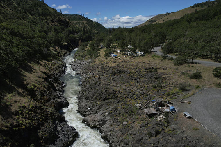 ASSOCIATED PRESS
                                Water rushes through Lyle Falls in the Klickitat River, a tributary that runs into the Columbia River, June 19, in Lyle, Wash. For generations, Indigenous people have fished for salmon and trout from scaffolds perched just above the sacred water.