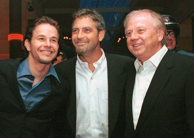 ASSOCIATED PRESS / 2000
                                Actors Mark Wahlberg, left, and George Clooney, center, stars of the film “The Perfect Storm,” pose with director/producer Wolfgang Petersen at the premiere in Danvers, Mass. Petersen, the German filmmaker whose WWII submarine epic “Das Boot” propelled him into a blockbuster Hollywood career, died Friday at his home in the Los Angeles neighborhood of Brentwood after a battle with pancreatic cancer. He was 81.