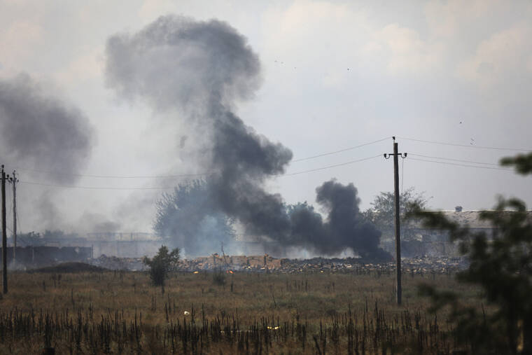 ASSOCIATED PRESS
                                Smoke rises over the site of an explosion at an ammunition storage facility of the Russian army near the village of Mayskoye, Crimea, today. Explosions and fires ripped through an ammunition depot in Russian-occupied Crimea today in the second suspected Ukrainian attack on the peninsula in just over a week, forcing the evacuation of more than 3,000 people.