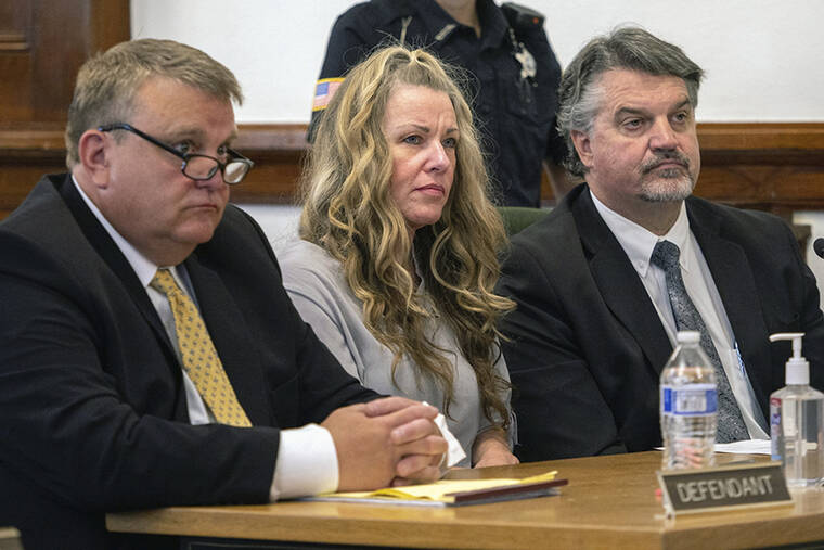 TONY BLAKESLEE/EAST IDAHO NEWS VIA AP, POOL
                                Lori Vallow Daybell sits between her attorneys for a hearing at the Fremont County Courthouse in St. Anthony, Idaho. Attorneys for a mom charged with conspiring to kill her children and then steal their social security benefits asked a judge on Tuesday to send the case back to a grand jury because they say the current indictment is confusing. Lori Vallow Daybell and her husband Chad Daybell have pleaded not guilty and could face the death penalty if convicted.