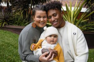ASSOCIATED PRESS / AUG. 15
                                Ellia Green with his partner Vanessa Turnbull-Roberts and their daughter Waitui pose in Sydney, Australia, Monday. Green, one of the stars of Australia’s gold medal-winning women’s rugby sevens team at the 2016 Olympics, has transitioned to male.