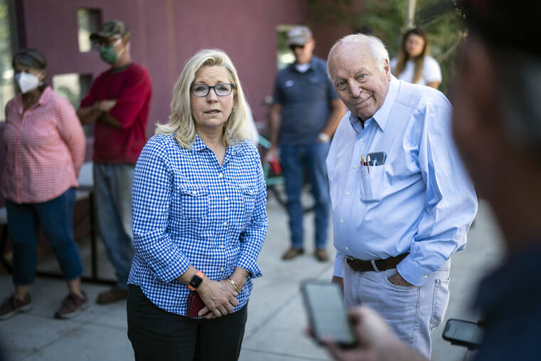 THE WASHINGTON POST VIA AP
                                Rep. Liz Cheney, R-Wyo., arrives, with her father, former Vice President Dick Cheney, to vote at the Teton County Library during the Republican primary election today in Jackson Hole, Wyo.