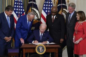 ASSOCIATED PRESS
                                President Joe Biden signs the Democrats’ landmark climate change and health care bill in the State Dining Room of the White House in Washington, Tuesday, Aug. 16, 2022.