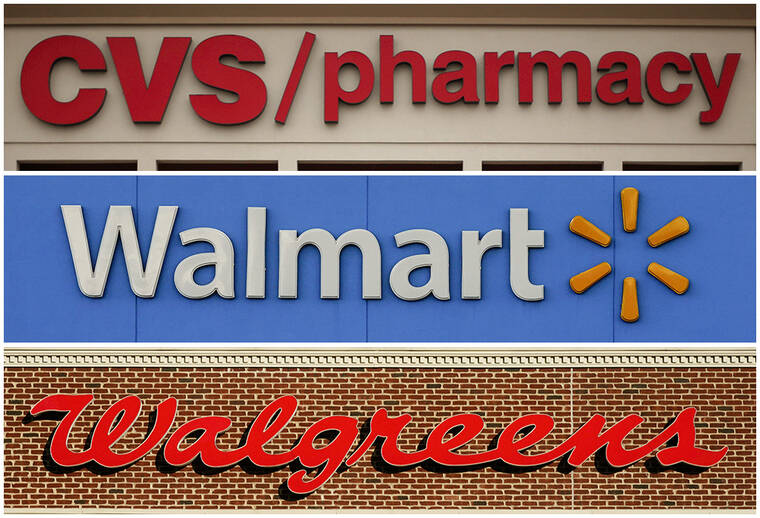 ASSOCIATED PRESS
                                This undated combination of file photos show the signs of CVS, Walmart and Walgreens. A federal judge in Cleveland awarded $650 million in damages, today, to two Ohio counties that won a landmark lawsuit against national pharmacy chains CVS, Walgreens and Walmart, claiming the way they distributed opioids to customers caused severe harm to communities.