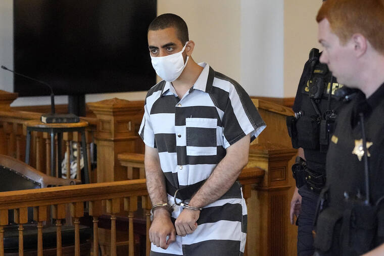 ASSOCIATED PRESS / AUG. 13
                                Hadi Matar, 24, center, arrives for an arraignment in the Chautauqua County Courthouse in Mayville, NY.