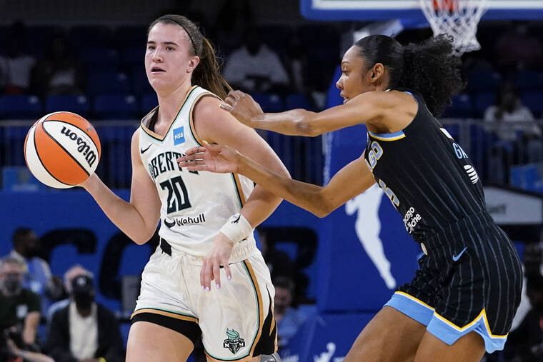 ASSOCIATED PRESS
                                New York Liberty guard Sabrina Ionescu, left, looks to pass as Chicago Sky guard Rebekah Gardner guards during the first half.