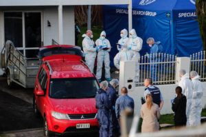 NEW ZEALAND HERALD VIA AP
                                New Zealand police investigators work at a scene in Auckland on Aug. 11 after bodies were discovered in suitcases.