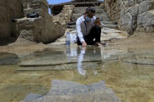 ASSOCIATED PRESS / JUNE 8
                                Syrian Christian Zuhair Al-Sahawi immerses his hand in water at the Bethany Beyond the Jordan baptismal site on the east bank of the Jordan River in Jordan.
