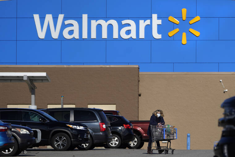 ASSOCIATED PRESS
                                A woman wheels a cart with her purchases out of a Walmart, in November 2020, in Derry, N.H. Walmart, the nation’s largest employer, is expanding its abortion coverage for employees, according to a memo sent to employees, today, after staying mum on the topic for months following the Supreme Court ruling that scrapped a nationwide right to abortion.