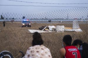 ASSOCIATED PRESS / AUG. 18
                                People look at the wreckage from a plane crash at Watsonville Municipal Airport in Watsonville, Calif., Thursday.