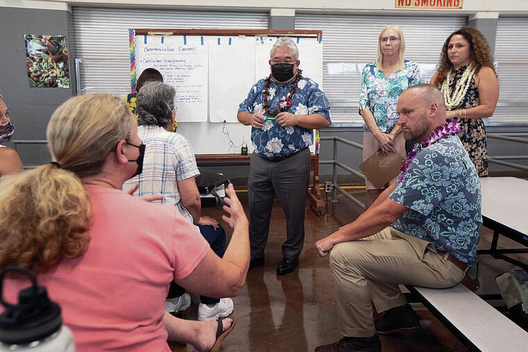 GEORGE F. LEE / GLEE@STARADVERTISER.COM
                                Keith Hayashi, center, along with several school principals and Board of Education members, listened to the community’s concerns.