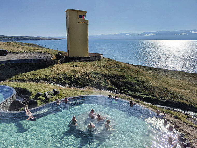 TRIBUNE NEWS SERVICE
                                GeoSea’s geothermally heated saltwater pool overlooks the Greenland Sea, the Arctic Circle and the Husavik lighthouse.