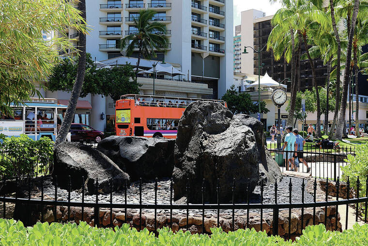 ASSOCIATED PRESS
                                The Healer Stones of Kapaemahu, which honor four “mahu” healers from Tahiti who visited Hawaii more than five centuries ago, are displayed at Waikiki beach in Honolulu in June.