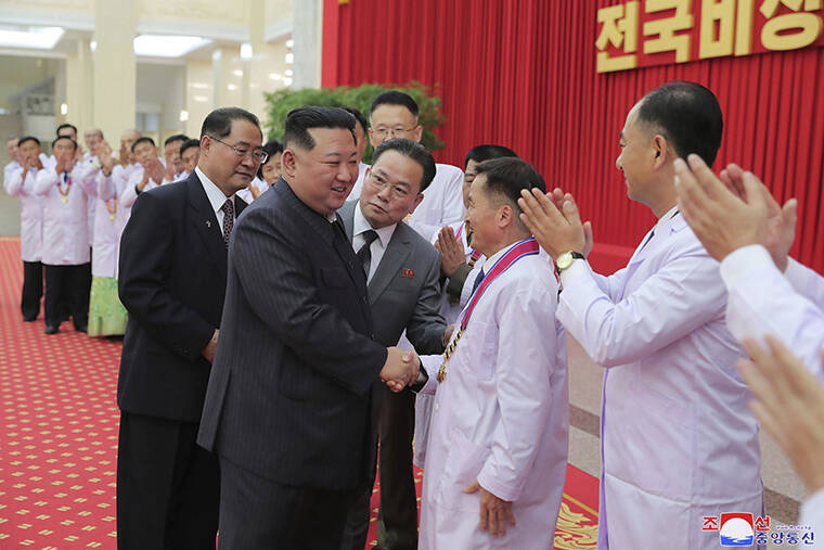 KOREAN CENTRAL NEWS AGENCY / KOREA NEWS SERVICE / AP
                                In this photo provided by the North Korean government, North Korean leader Kim Jong Un shakes hands with a health official in Pyongyang, North Korea, Wednesday, Aug. 10. Kim has declared victory over COVID-19 and ordered an easing of preventive measures.