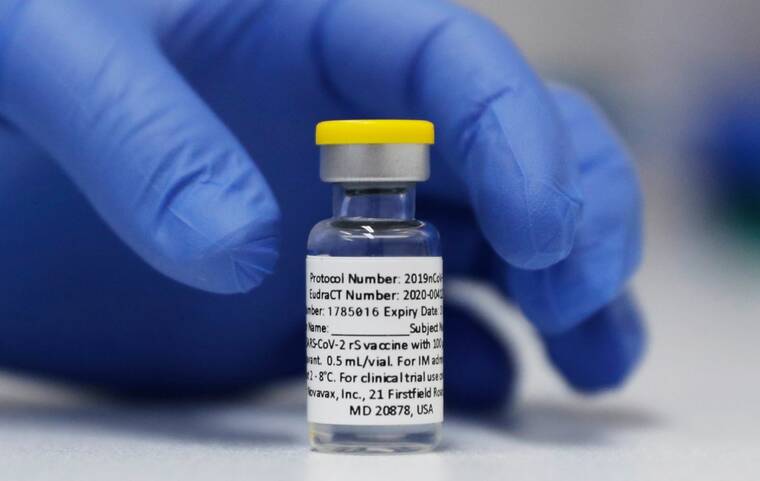ASSOCIATED PRESS
                                A vial of the Phase 3 Novavax coronavirus vaccine is prepared for use, in October 2020, in a trial at St. George’s University hospital in London. The Hawaii Department of Health today announced that scheduling opportunities are now available for the COVID-19 vaccine manufactured by Novavax.