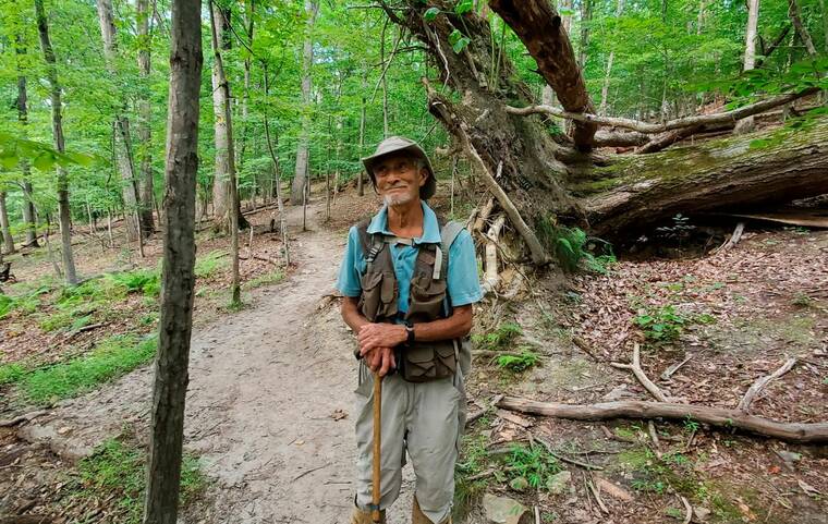 JOE VILLARI/VIRGINIA OUTDOORS FOUNDATION VIA ASSOCIATED PRESS
                                William H. “Marty” Martin poses for a picture at the Bull Run Mountains Preserve in Broad Run, Va., in July 2021. Martin, a respected snake researcher who had been making significant discoveries about the species since childhood, died Aug. 3 after being bitten the day before by a timber rattler.