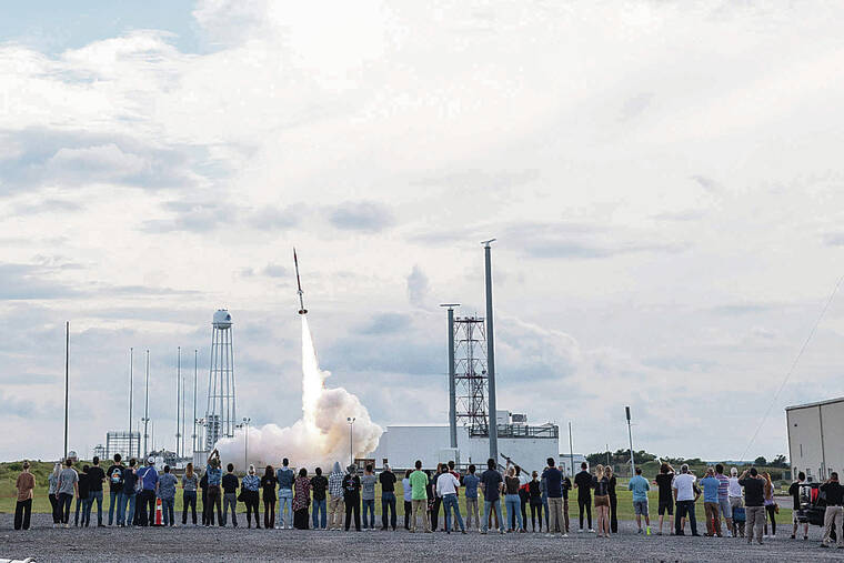 COURTESY UNIVERSITY OF HAWAII 
                                The crowd watched the launch of the 44-foot research rocket at NASA’s Wallops Flight Facility in Virginia.