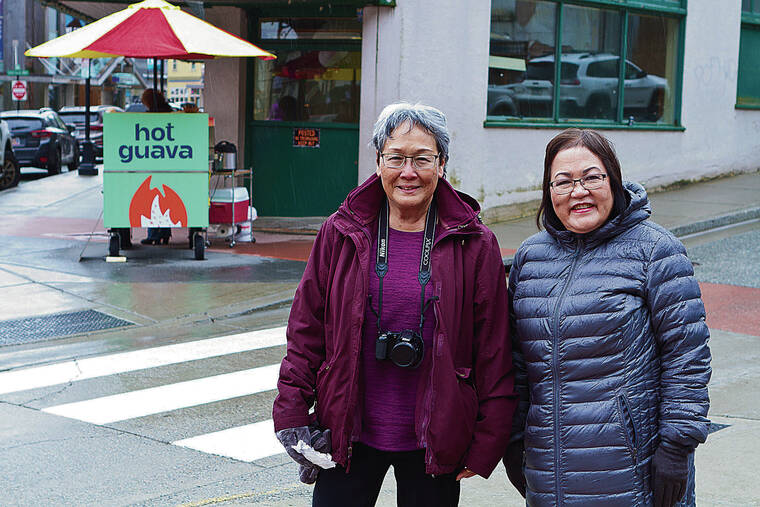 On a cruise stop in chilly Juneau, Alaska, in May, Doreen Matsumoto of Honolulu and Kathy Sproles, a former Hawaii resident, came across a street vendor selling “Hot Guava” drinks. Photo by Randy Matsumoto.