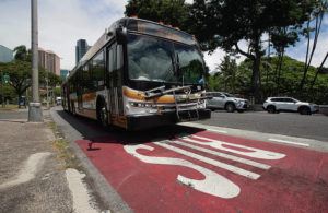 CINDY ELLEN RUSSELL / CRUSSELL@STARADVERTISER.COM
                                A city bus approached the bus stop at Punchbowl and King streets in downtown Honolulu.